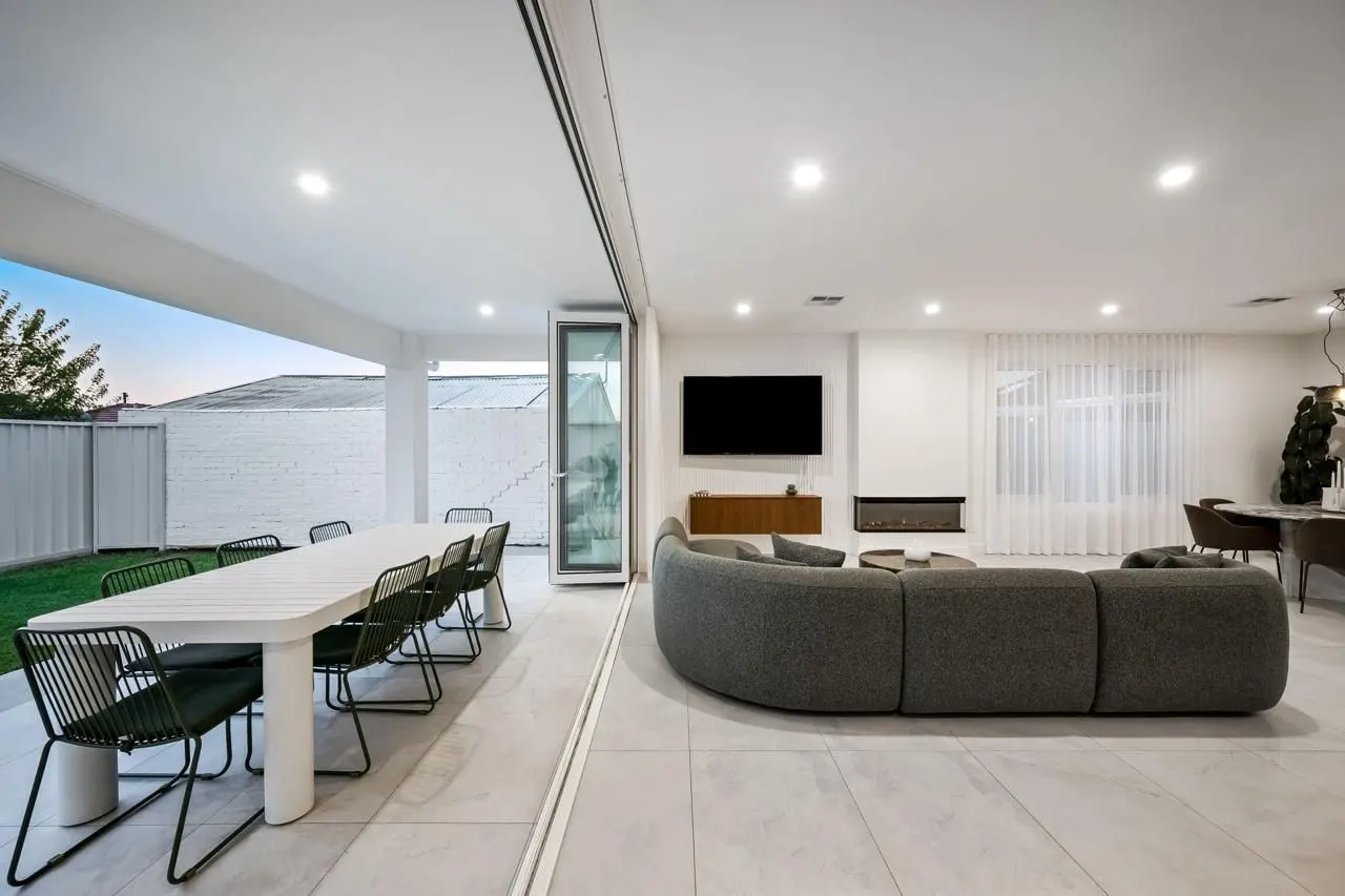 Living room opening to a covered alfresco